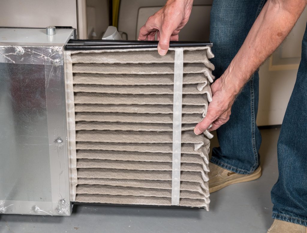 Dirty and clogged AC filter getting replaced