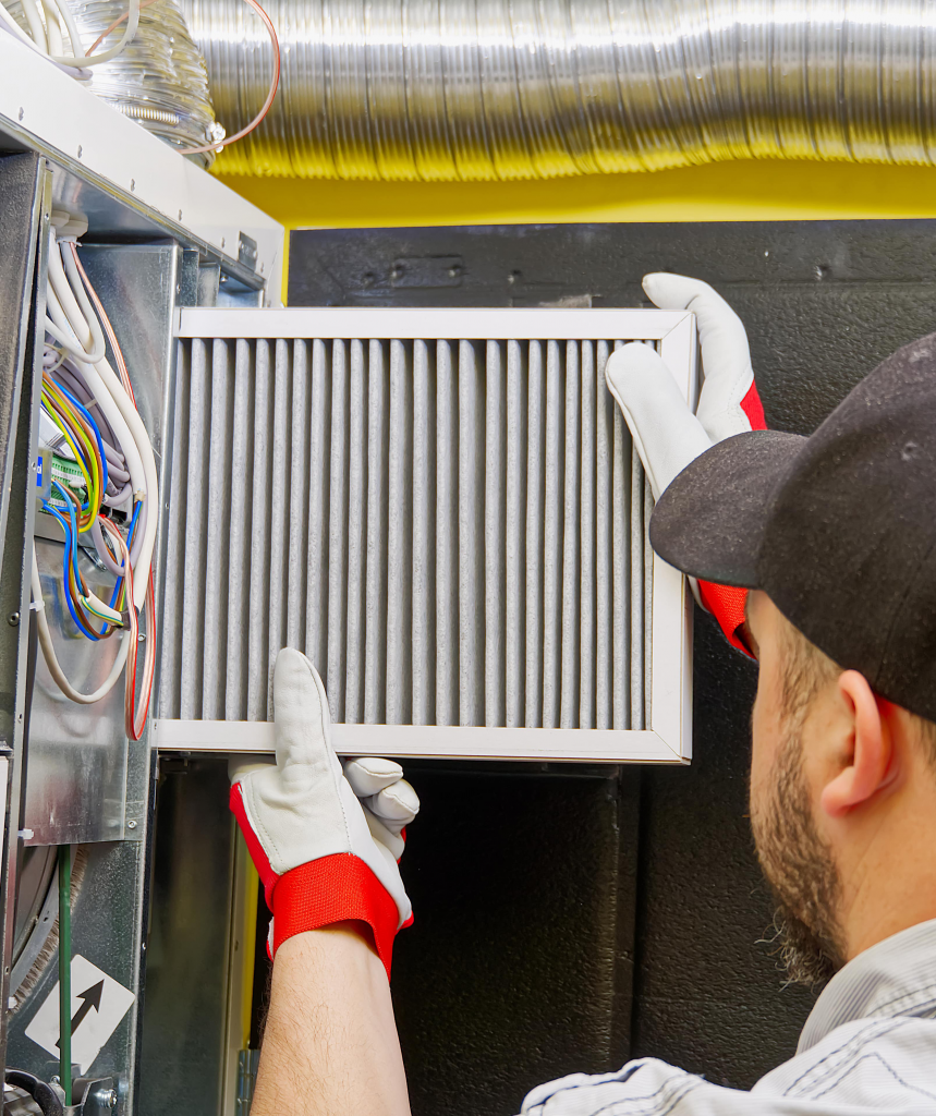 Technician replacing filter for furnace in Chicago